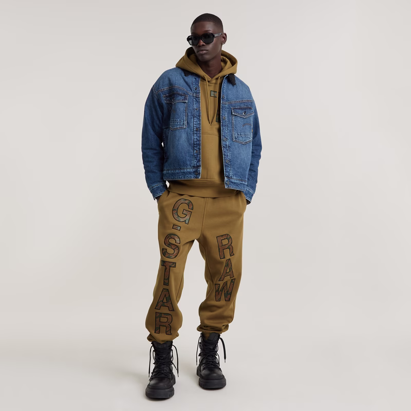 Embro Print Loose Tapered Sweat Pants