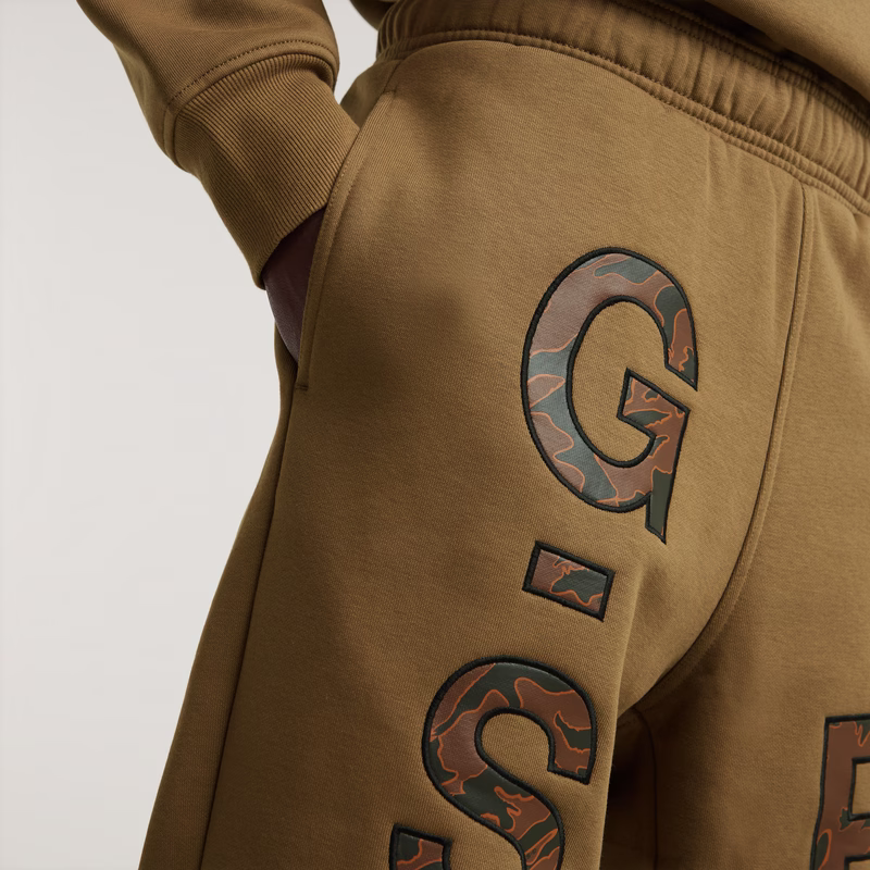 Embro Print Loose Tapered Sweat Pants